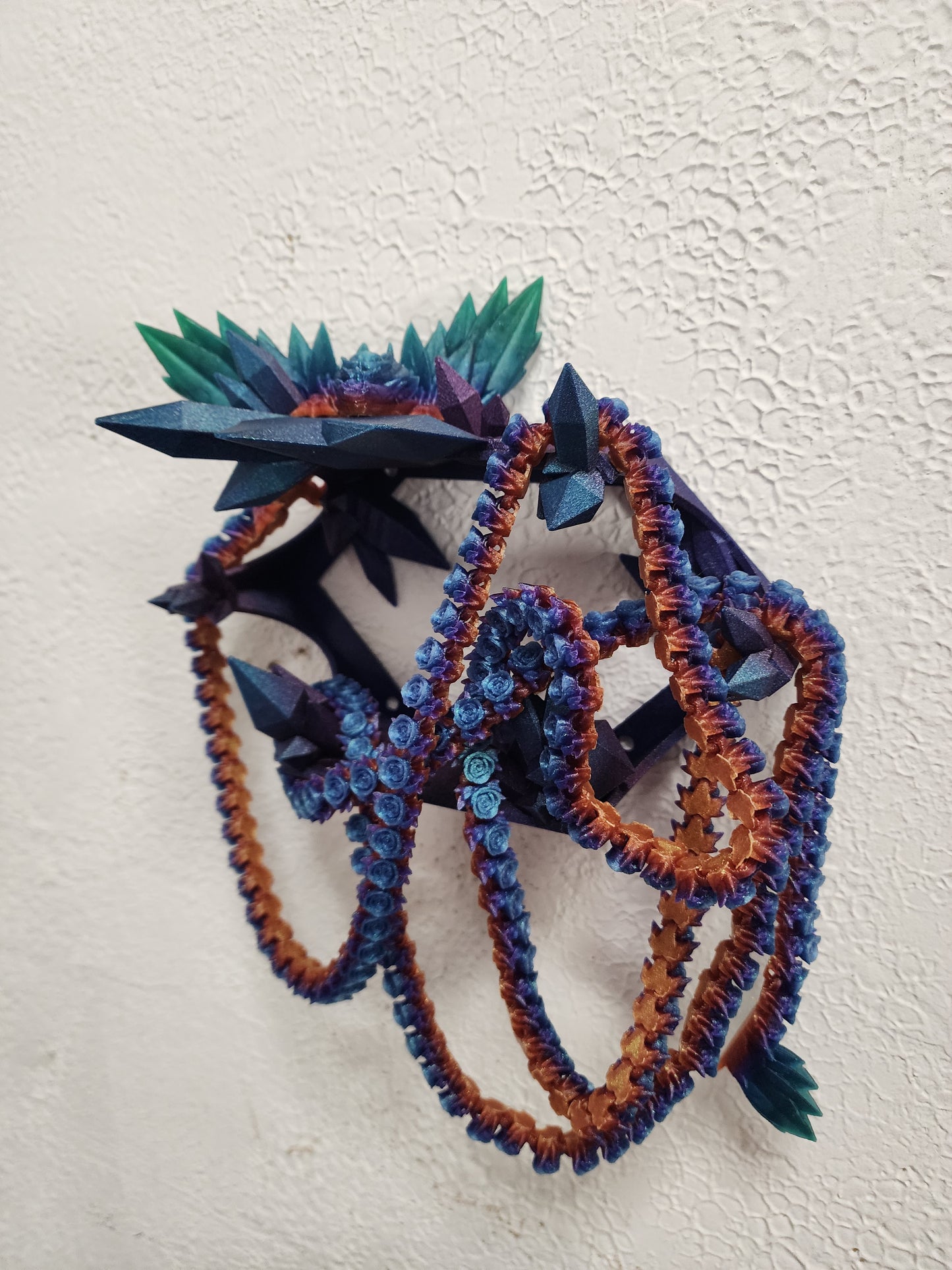 3D printed articulated extra long Rose Dragon with color matching wall mount.