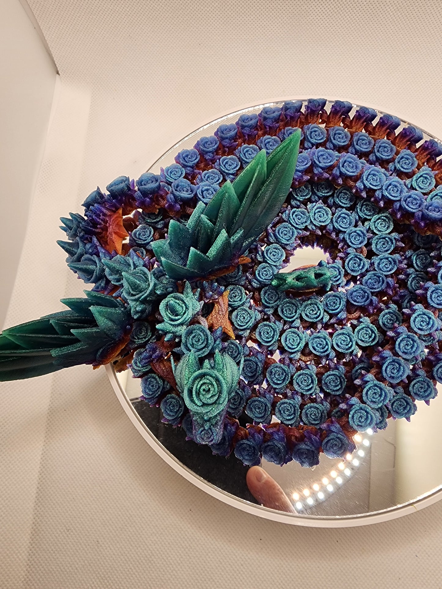 3D printed articulated extra long Rose Dragon with color matching wall mount.