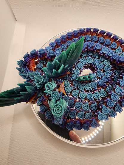 3D printed articulated extra long Rose Dragon with color matching wall mount.