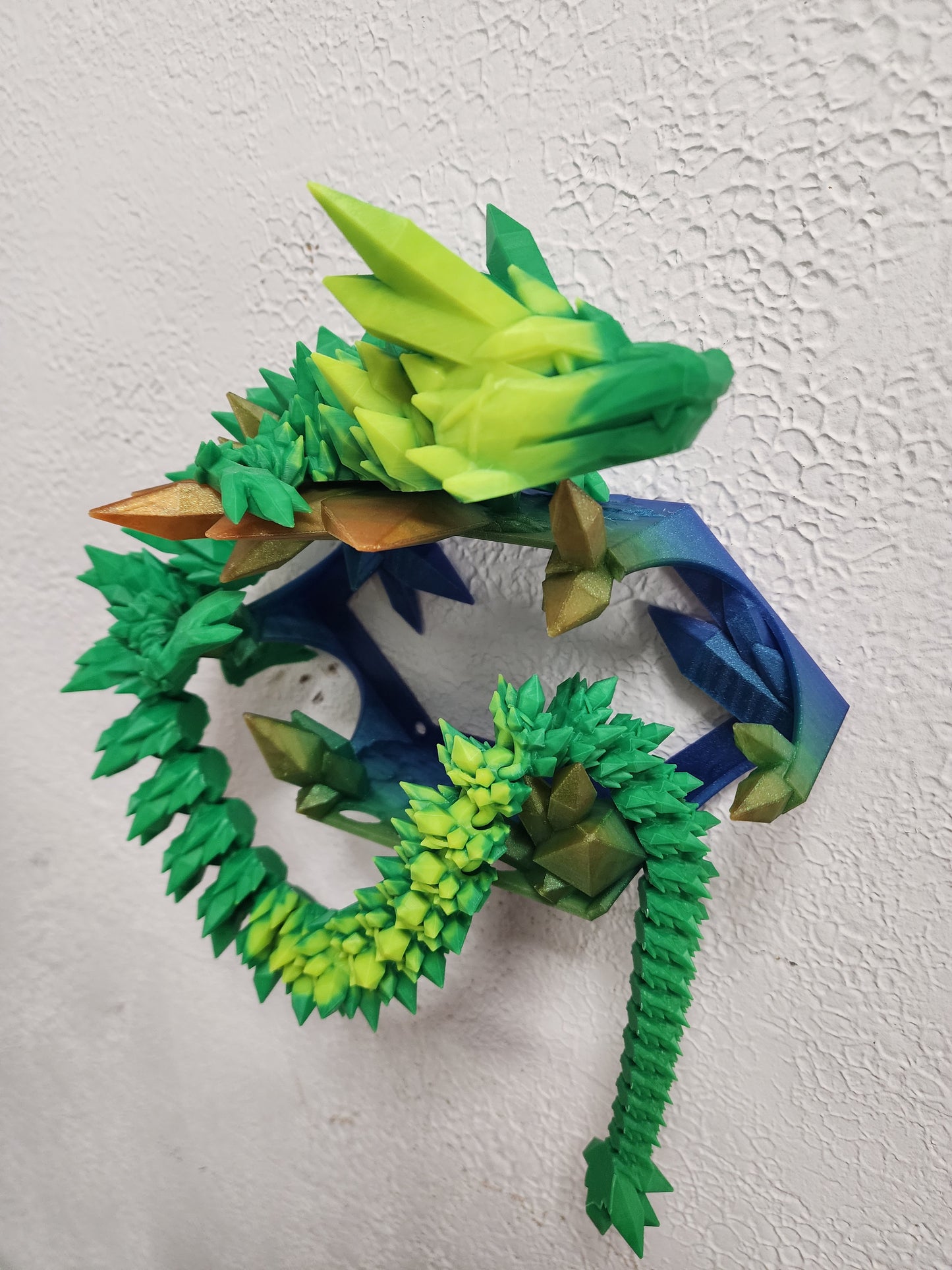 3D printed articulated heat color changing Crystal Dragon with custom wall mount.