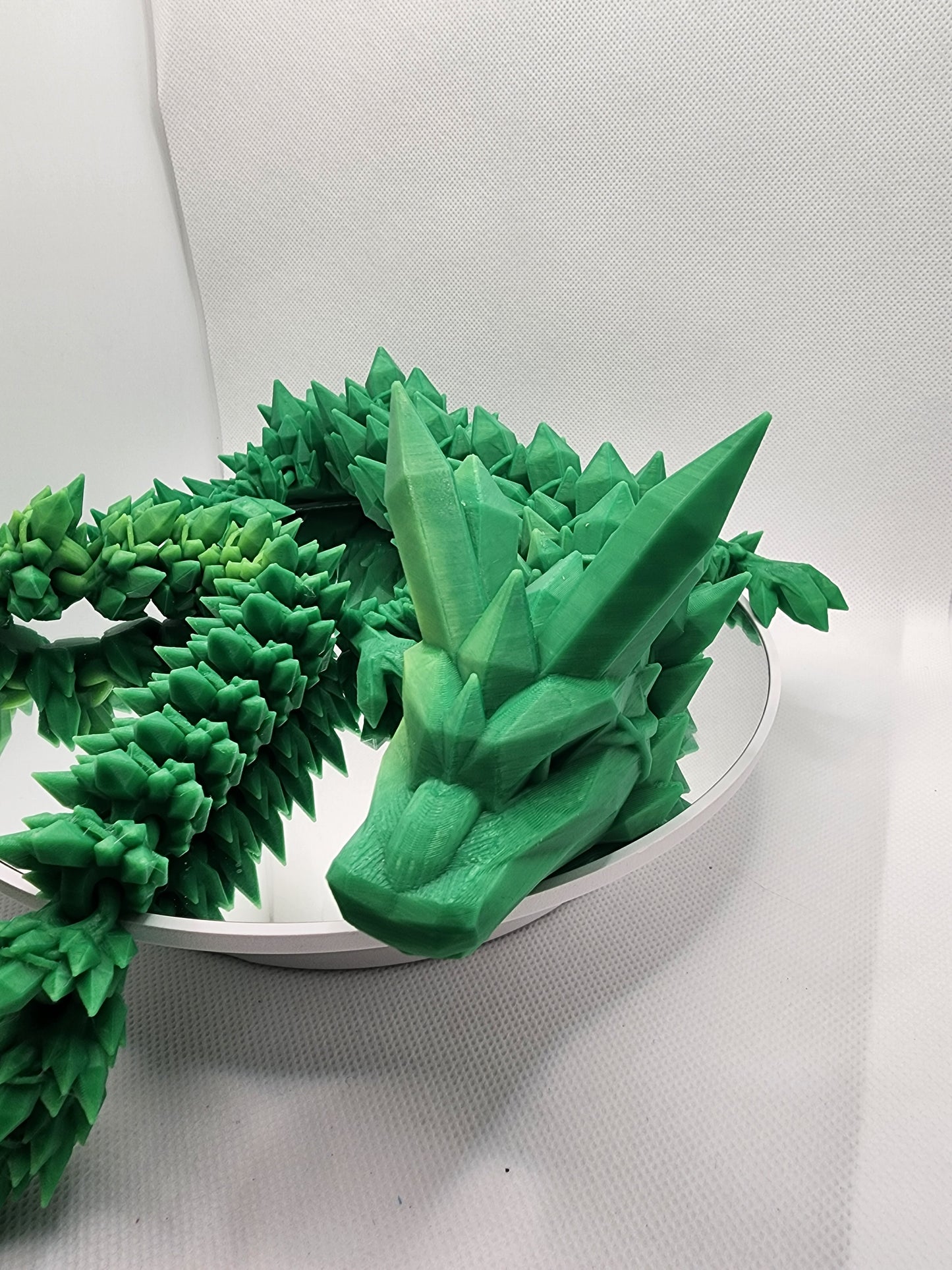 3D printed articulated heat color changing Crystal Dragon with custom wall mount.