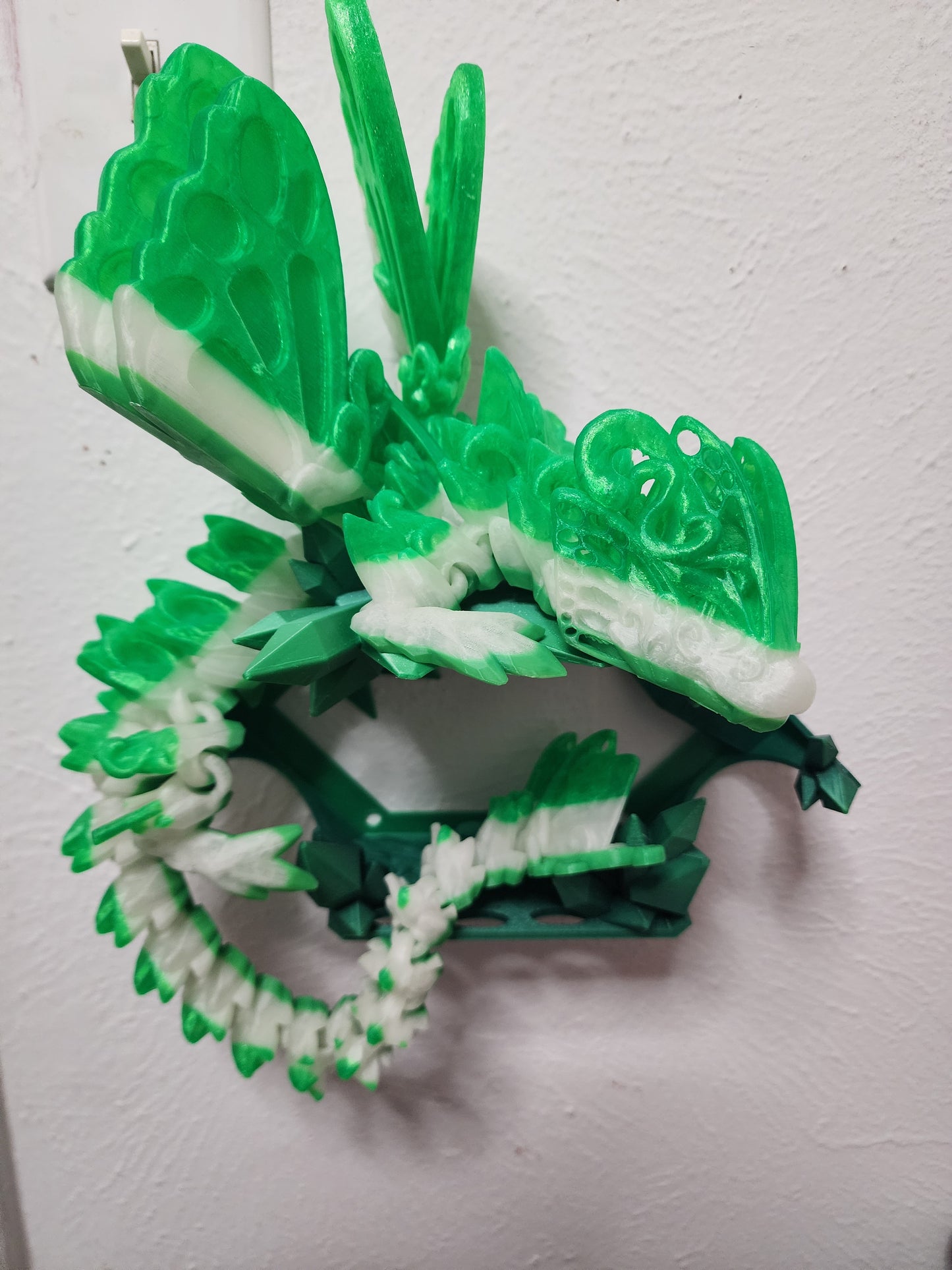 3D printed custom articulated Butterfly Dragon with wall mount.