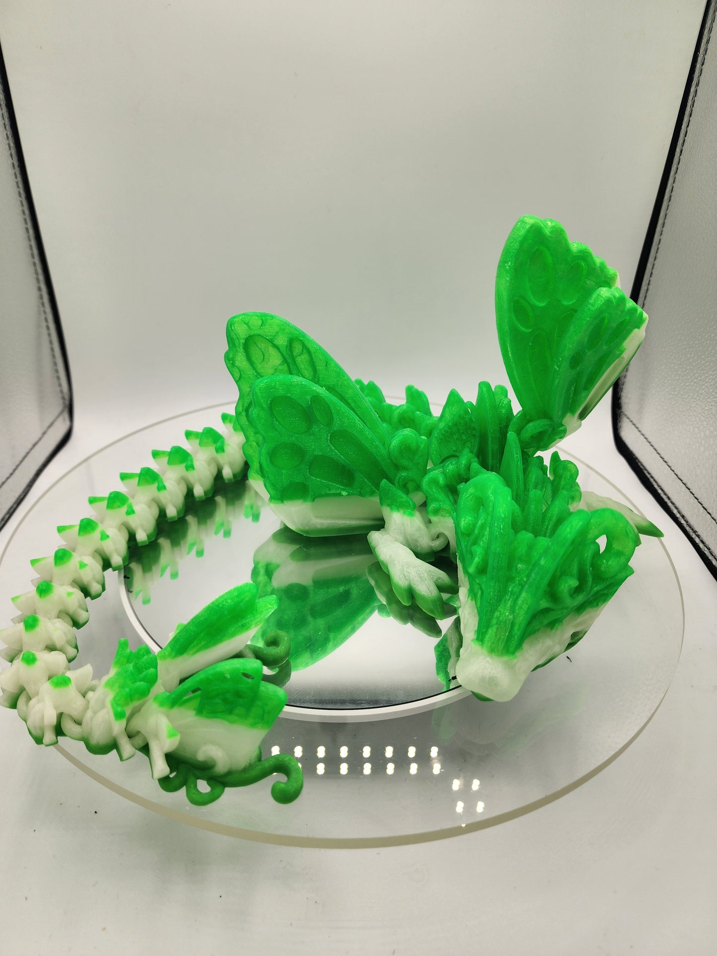 3D printed custom articulated Butterfly Dragon with wall mount.