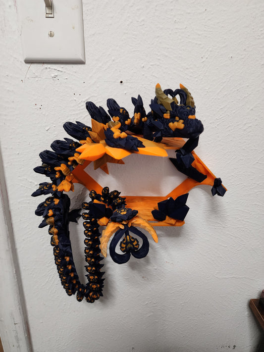 3D printed articulated Light Heart Dragon with custom color matching wall mount.