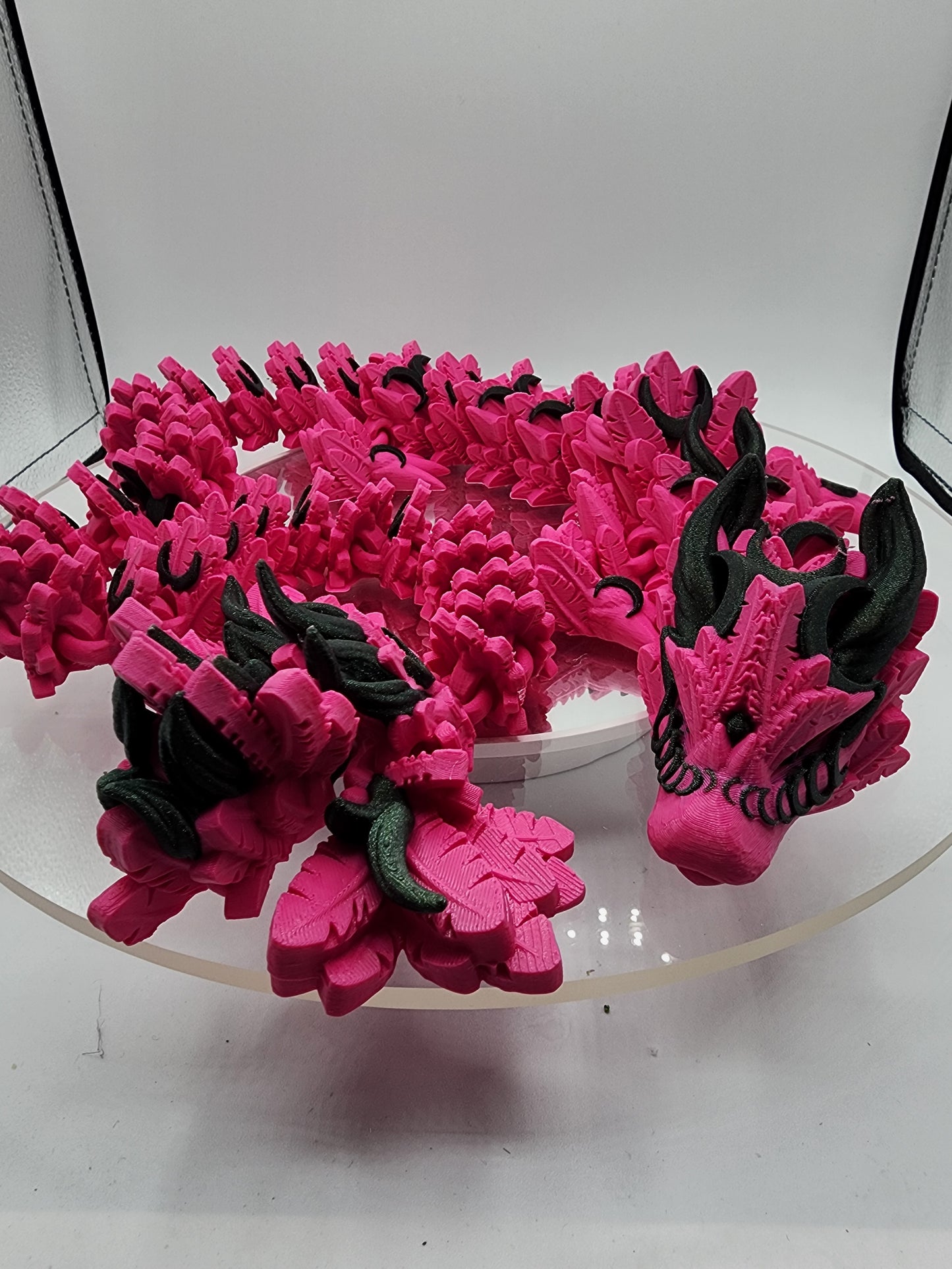 3D printed articulated Lunar Dragon with color-matching custom wall mount.