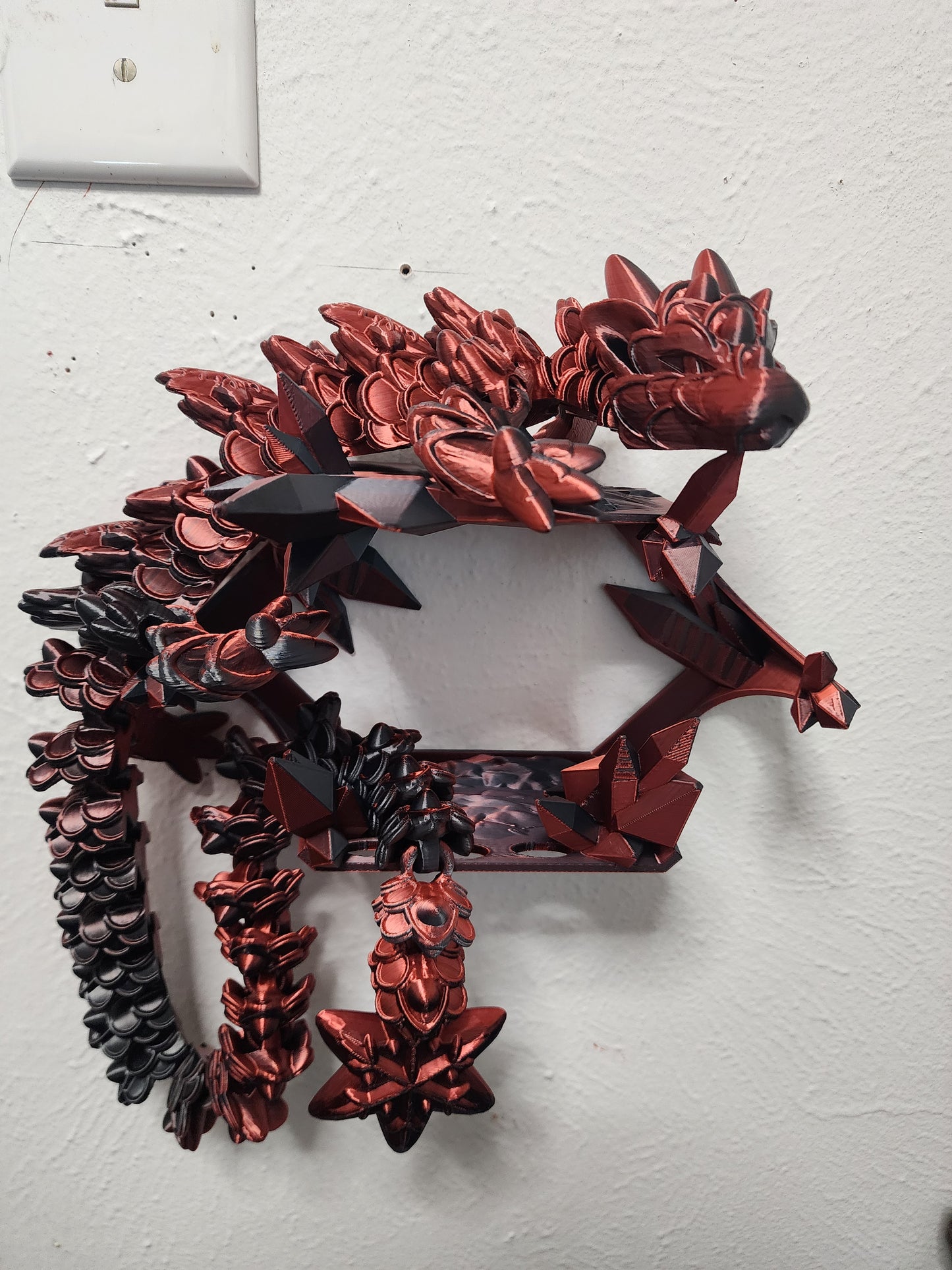 3D printed articulated color-changing Ginger Bread Dragon with wall mount.