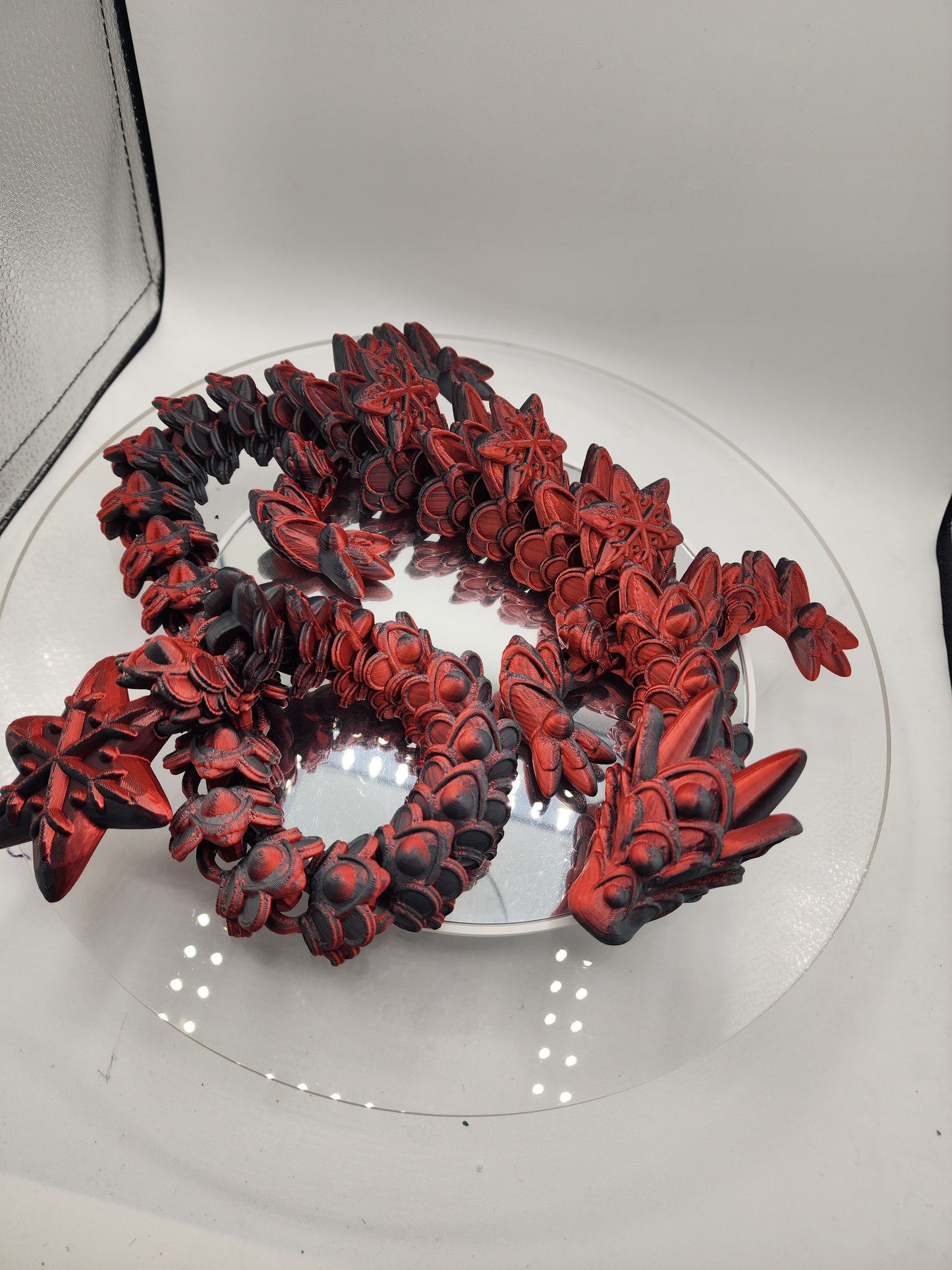 3D printed articulated color-changing Ginger Bread Dragon with wall mount.