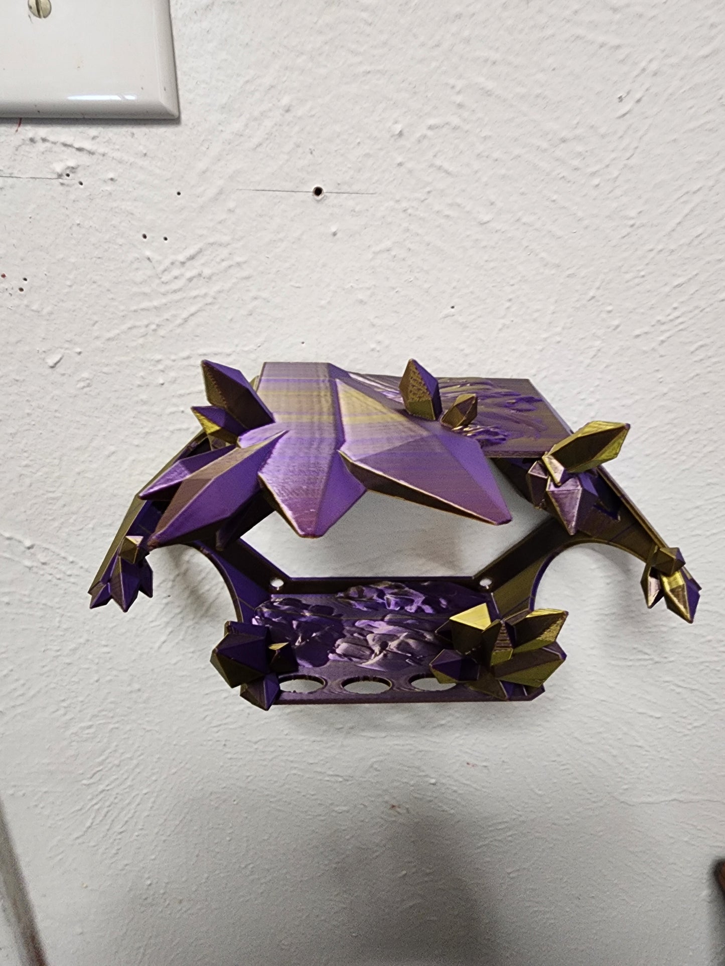 3D-printed, articulated color-changing Ginger Bread Dragon with custom wall mount.