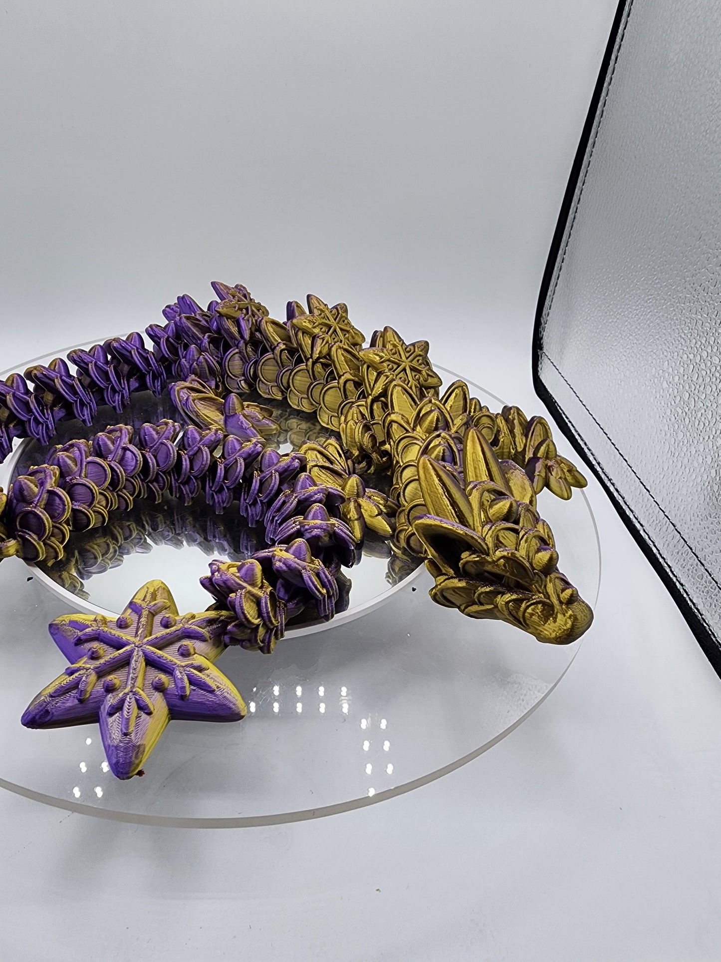3D-printed, articulated color-changing Ginger Bread Dragon with custom wall mount.