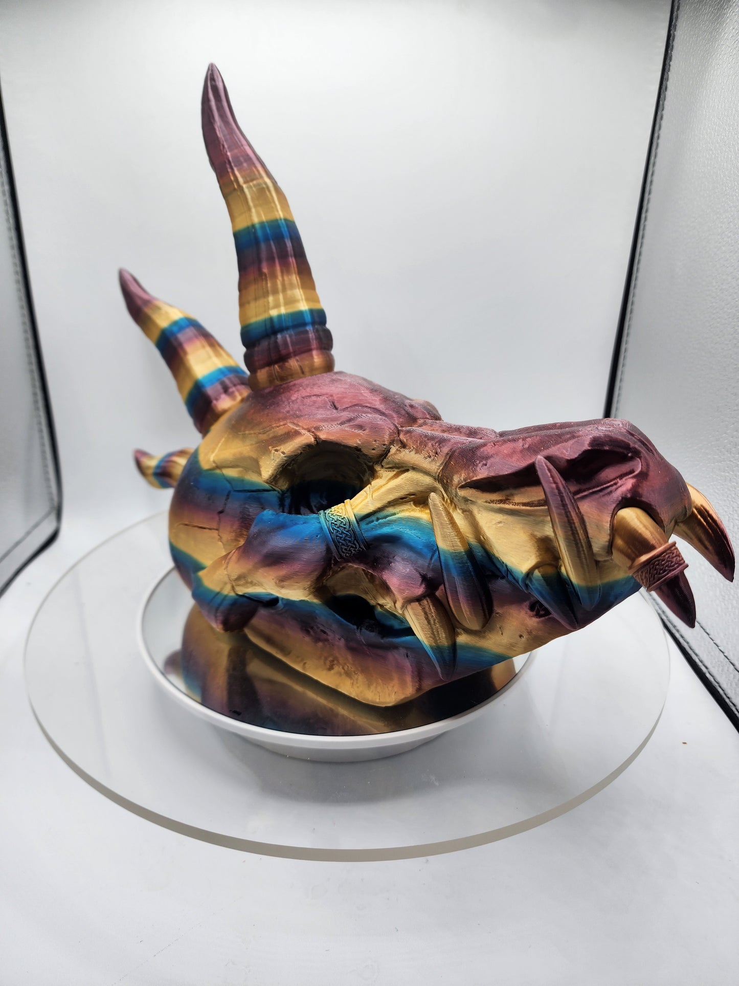 3D printed multi-color dragon skull with horns.