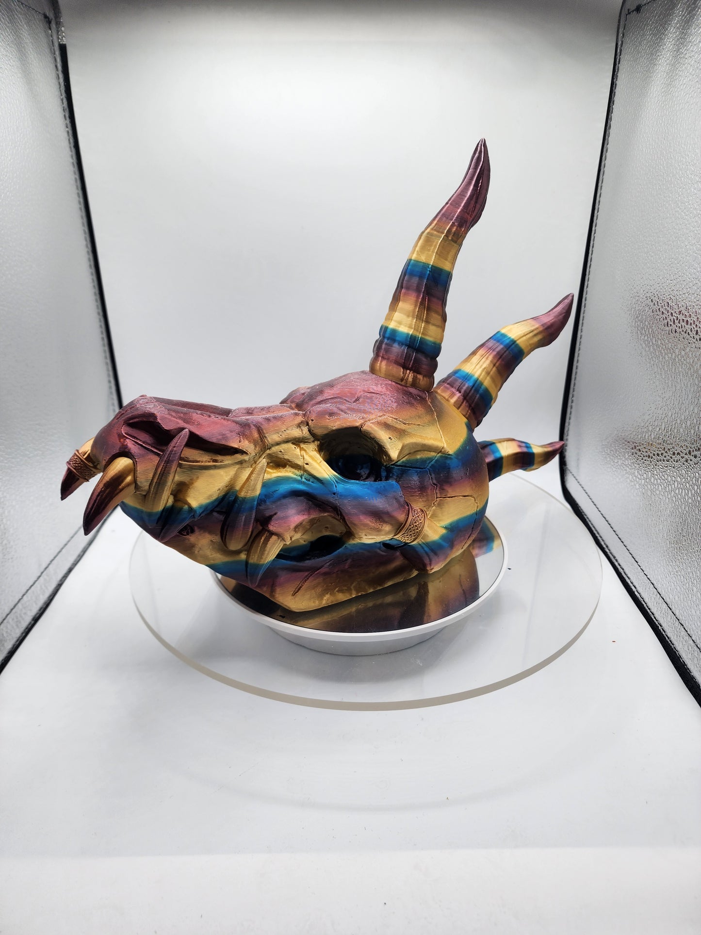 3D printed multi-color dragon skull with horns.