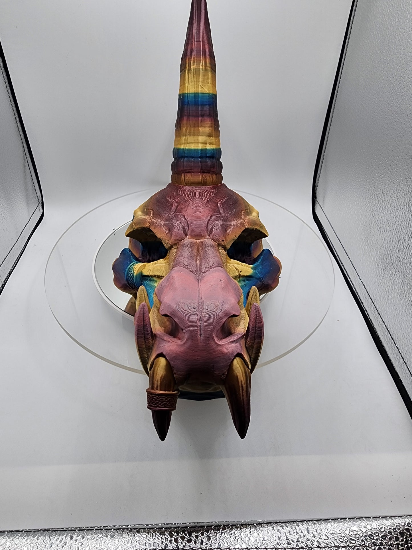 3D printed multi-color dragon skull with horns.