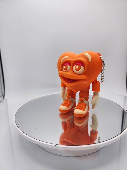 3D printed articulated Valentine's Day Herbert the Heart keychain.