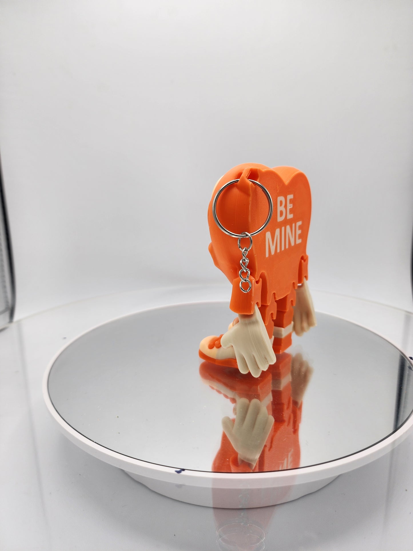 3D printed articulated Valentine's Day Herbert the Heart keychain.