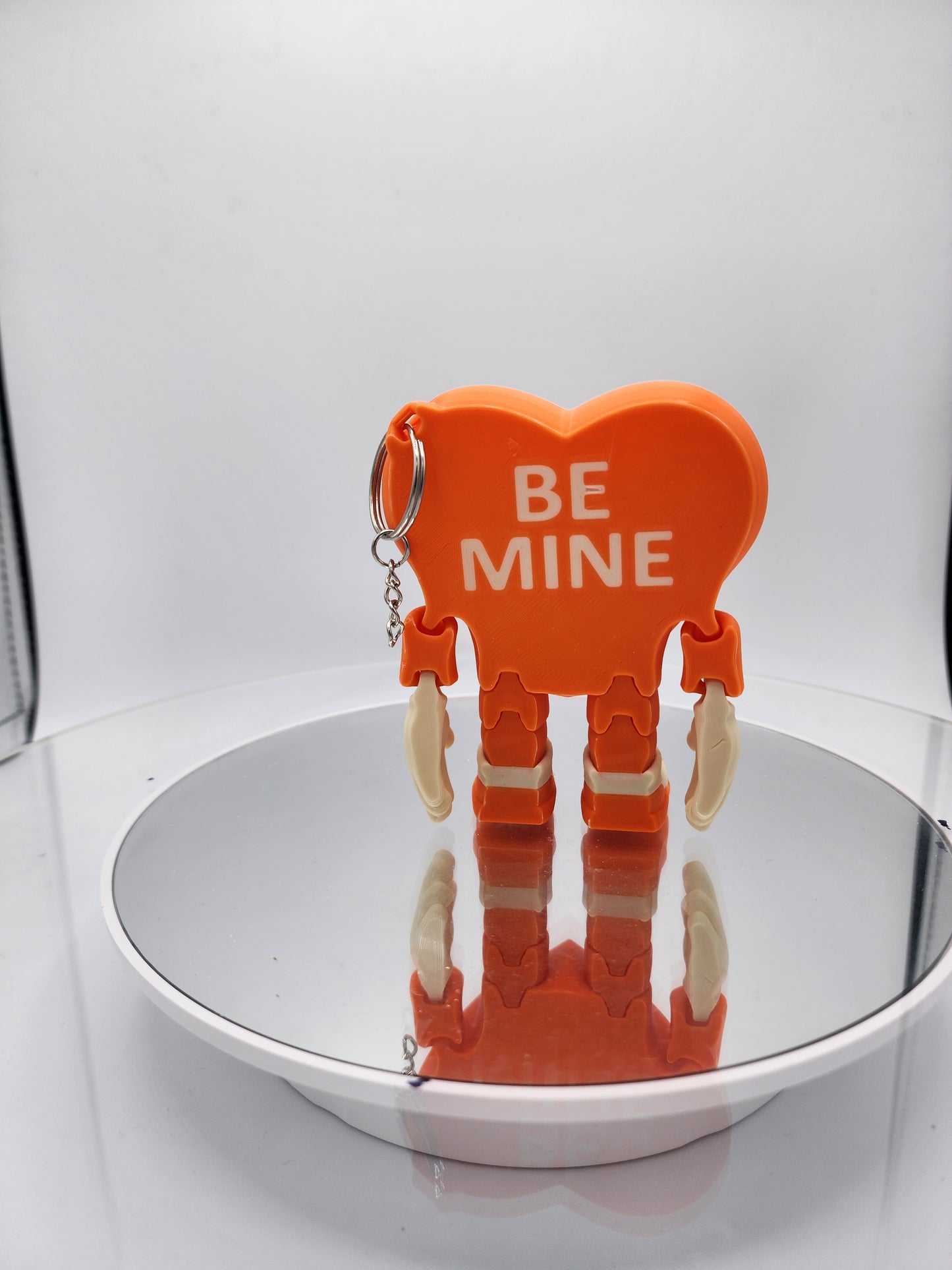 3D printed articulated Valentine's Day Herbert the Heart keychain.