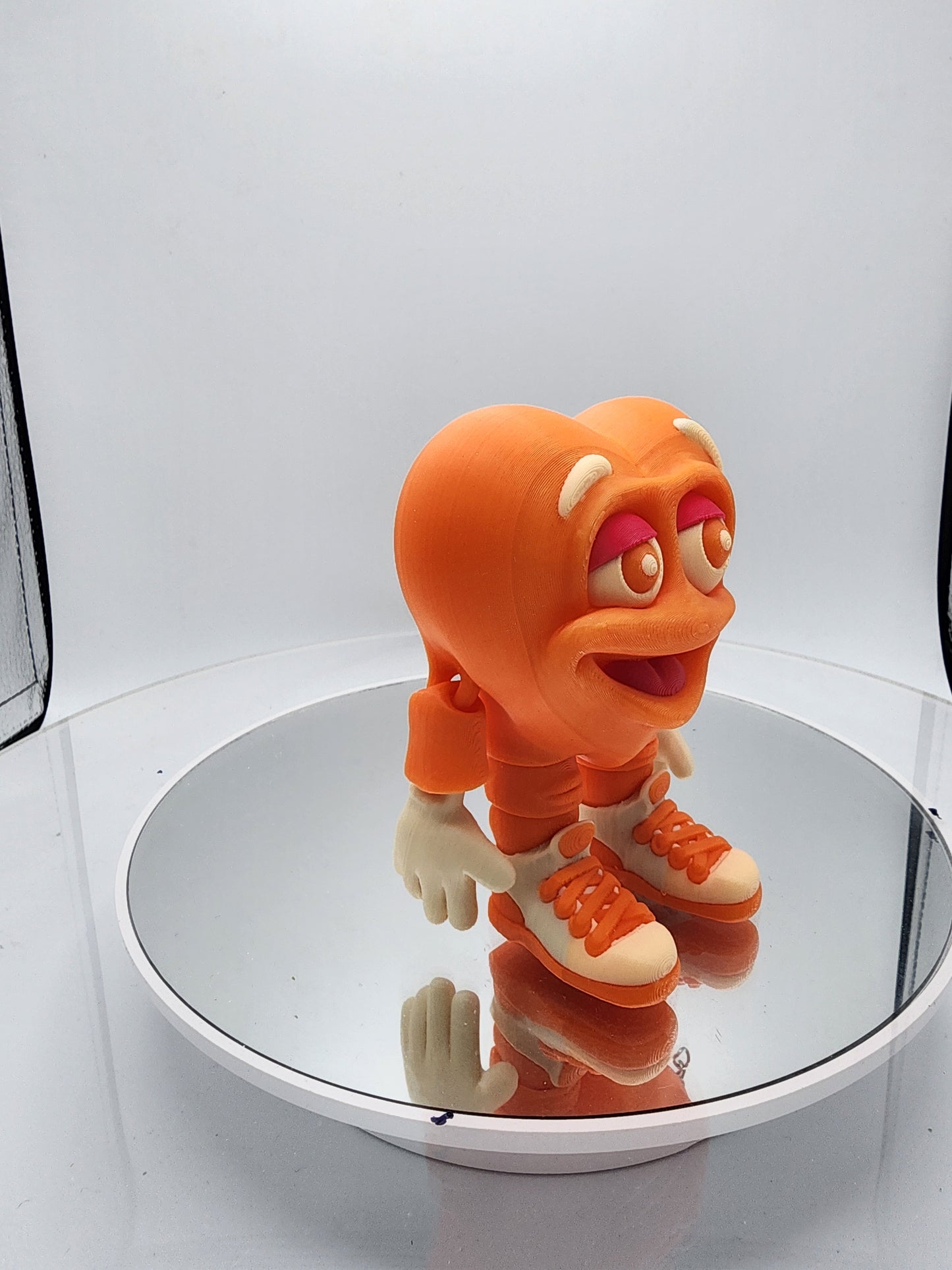 3D printed articulated Valentine's Day Herbert the Heart keychain.