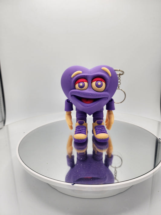 3D printed articulated Valentine's Day Herbert the Heart keychain.