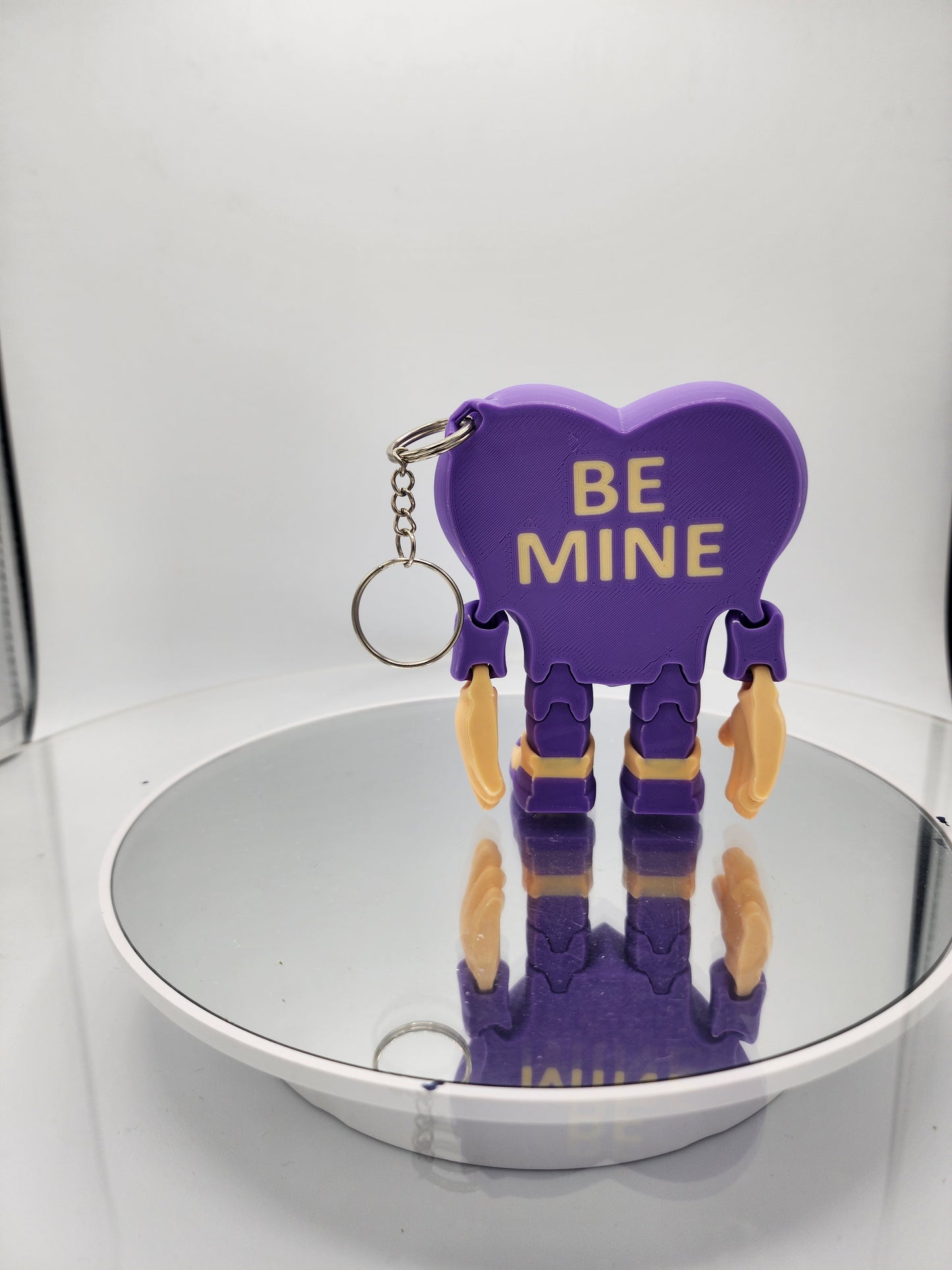 3D printed articulated Valentine's Day Herbert the Heart keychain.